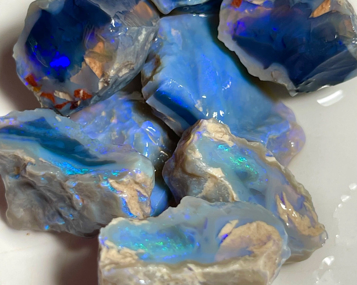 Lightning Ridge Black & Dark Knobby opal splits 135.00cts Mostly blues with some Greens bars sowing potential to cut 23x20x8mm to 17x15x12mm NSW185