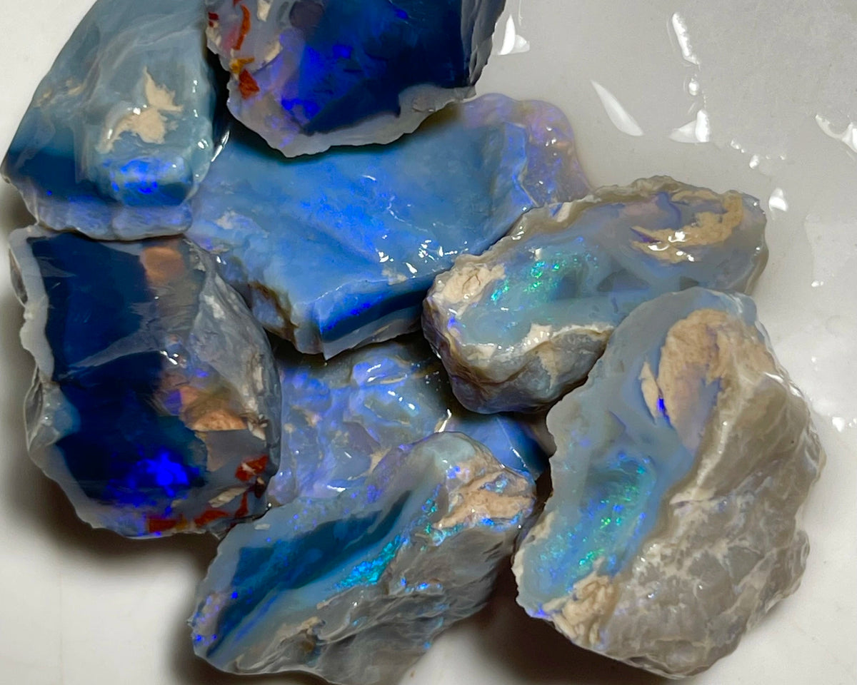 Lightning Ridge Black & Dark Knobby opal splits 135.00cts Mostly blues with some Greens bars sowing potential to cut 23x20x8mm to 17x15x12mm NSW185