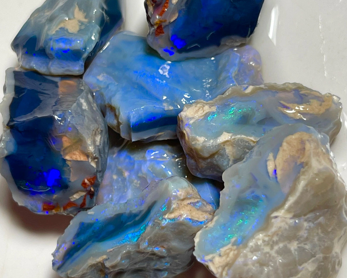 Lightning Ridge Black & Dark Knobby opal splits 135.00cts Mostly blues with some Greens bars sowing potential to cut 23x20x8mm to 17x15x12mm NSW185