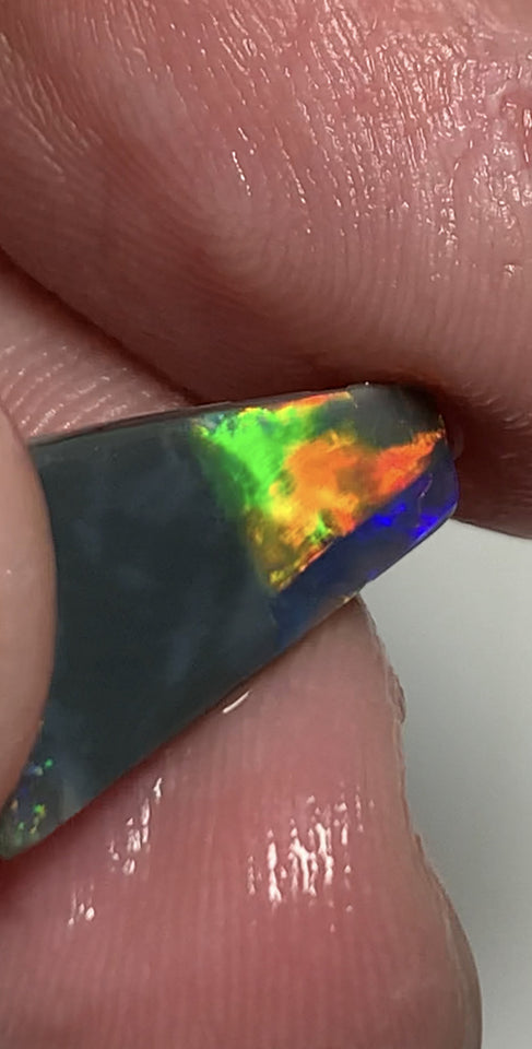 Australian Opal Gem Grade Single semi Black 3.4cts Rub/Rough Super bright Reds & Rainbow of Multifires Broad flash / Flagstone pattern 16x8x3mm WSJ40