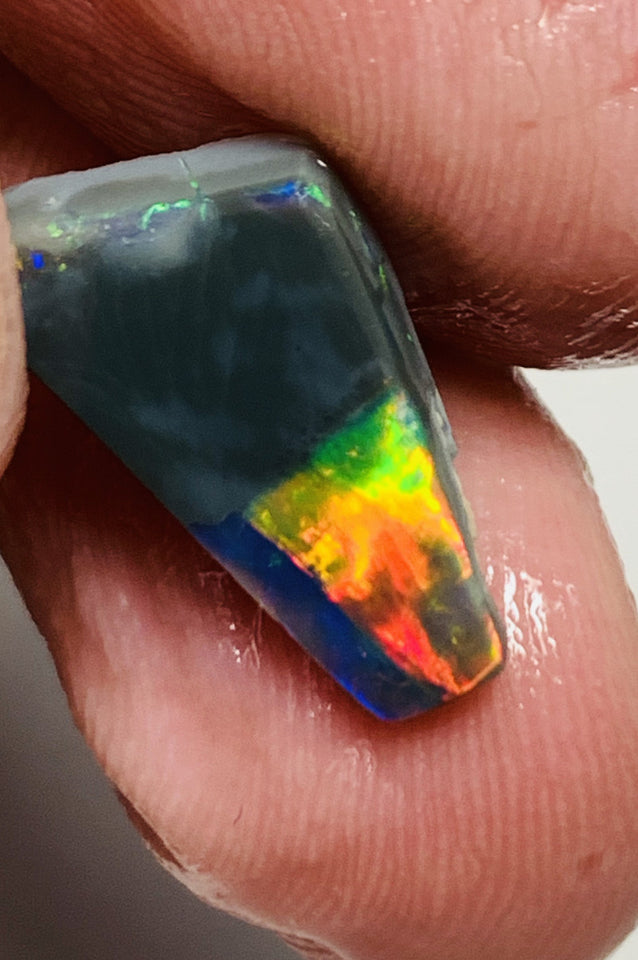 Australian Opal Gem Grade Single semi Black 3.4cts Rub/Rough Super bright Reds & Rainbow of Multifires Broad flash / Flagstone pattern 16x8x3mm WSJ40
