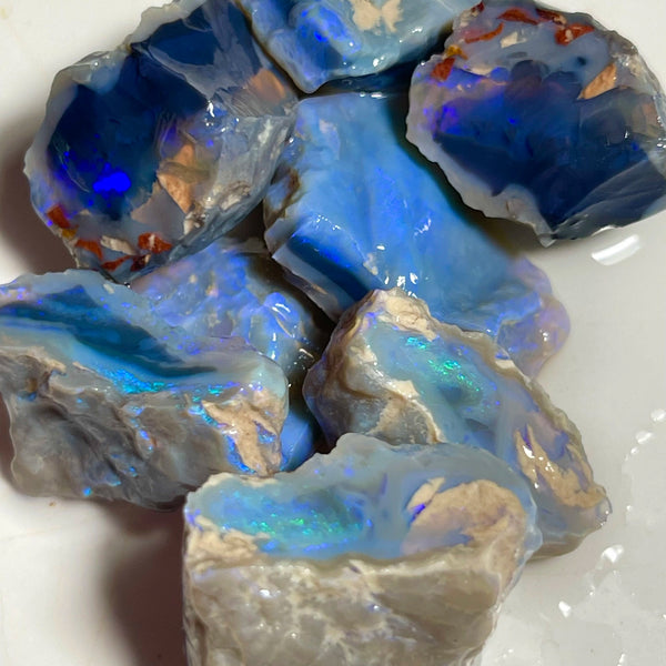 Lightning Ridge Black & Dark Knobby opal splits 135.00cts Mostly blues with some Greens bars sowing potential to cut 23x20x8mm to 17x15x12mm NSW185