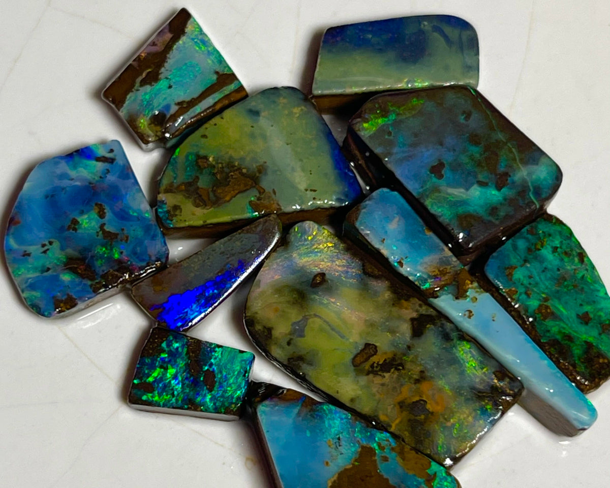 Winton Boulder opal Rubs/rough/preforms parcel 76.50cts Nice faces mostly greens/blues/Yellows 23x10x3 to 9x5x2mm NEW939