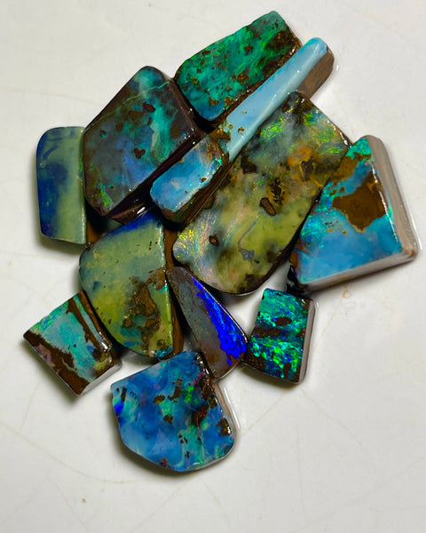 Winton Boulder opal Rubs/rough/preforms parcel 76.50cts Nice faces mostly greens/blues/Yellows 23x10x3 to 9x5x2mm NEW939