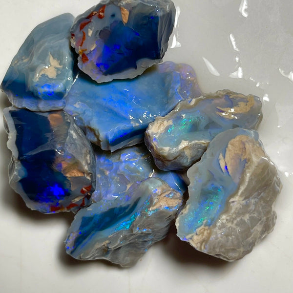 Lightning Ridge Black & Dark Knobby opal splits 135.00cts Mostly blues with some Greens bars sowing potential to cut 23x20x8mm to 17x15x12mm NSW185