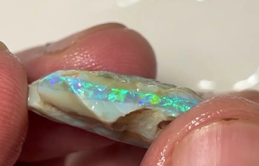 One to cut  Lightning Ridge Dark base Crystal Seam opal rough 19.00cts Very Bright Yellow/Green/Blue Dominant fires to cut & polish  24.000 x 20.000 x 8.000 mm NEW901