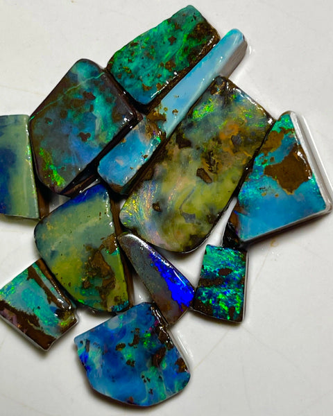 Winton Boulder opal Rubs/rough/preforms parcel 76.50cts Nice faces mostly greens/blues/Yellows 23x10x3 to 9x5x2mm NEW939