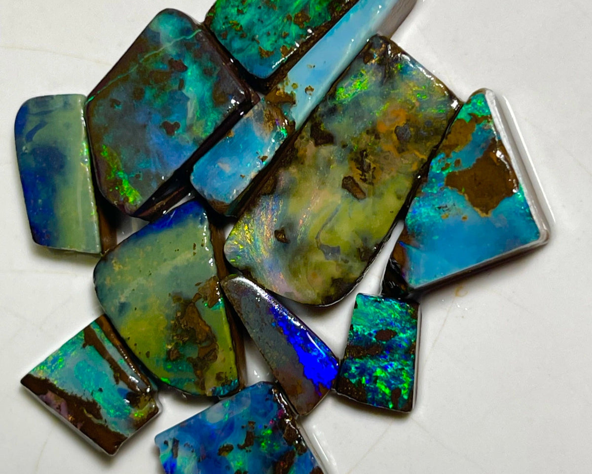 Winton Boulder opal Rubs/rough/preforms parcel 76.50cts Nice faces mostly greens/blues/Yellows 23x10x3 to 9x5x2mm NEW939